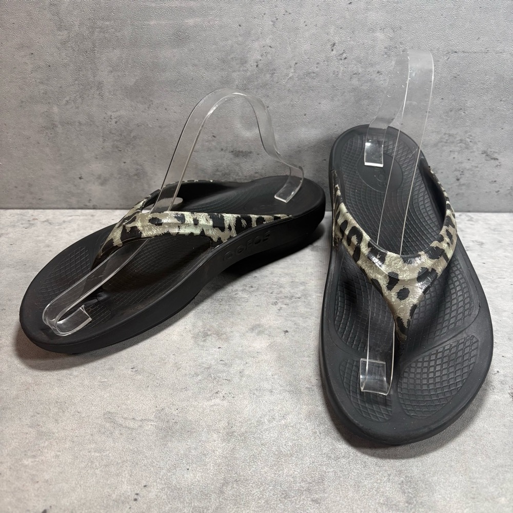 OOFOS Women's Black Flip Flop Sandals with Leopard Print Straps